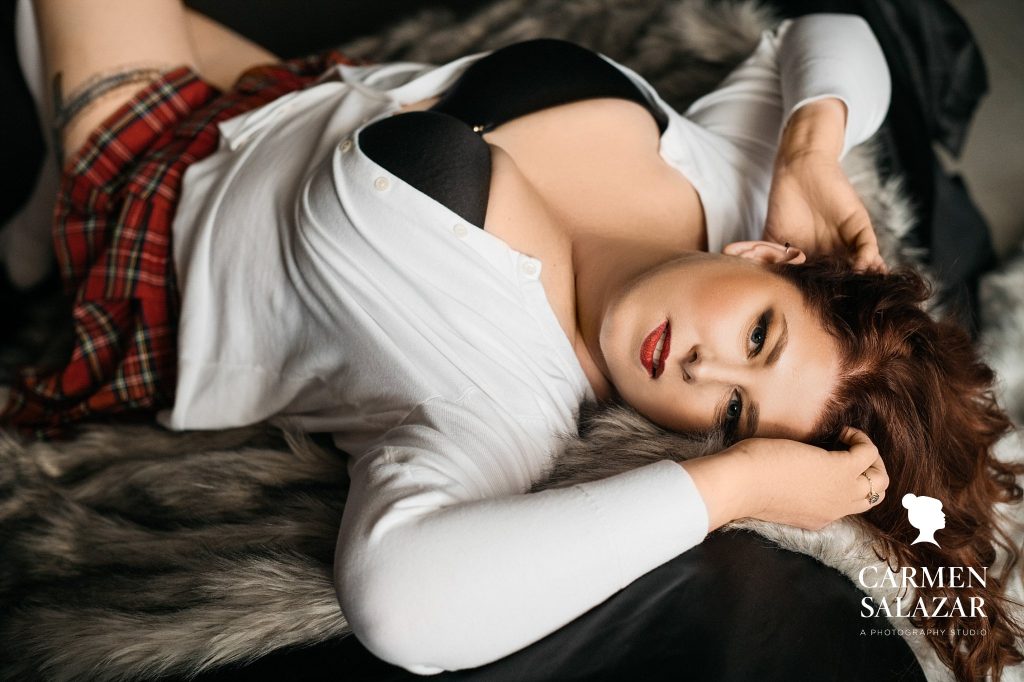 Woman in cardigan, black bra, plaid skirt, Modest lingerie for boudoir photography, by Carmen Salazar