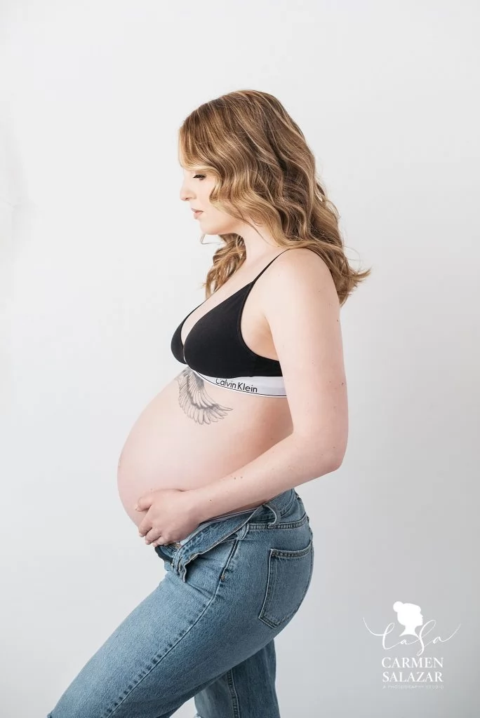 blonde woman in bra and jeans, maternity boudoir photography, Carmen Salazar Photography