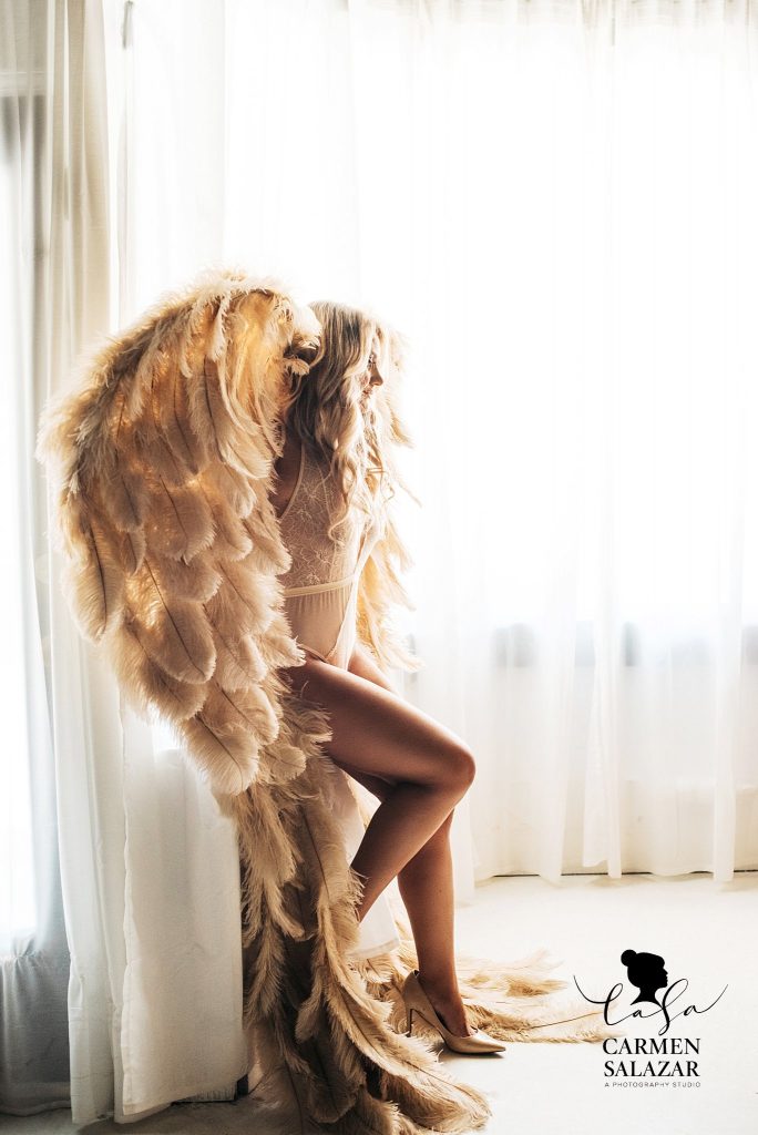 Angel wing boudoir inspired photography by Carmen Salazar; photographing feminine greatness
