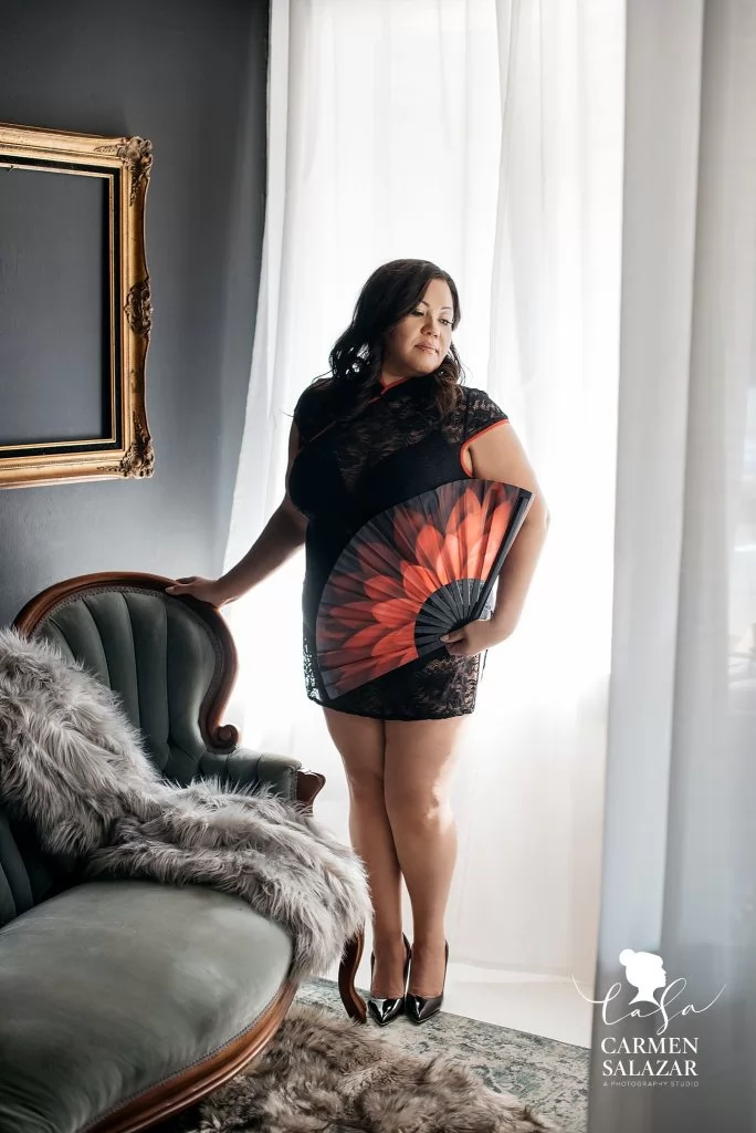 Woman posing in black dress and fan Non-Lingerie Outfits for Boudoir Photography by Carmen Salazar