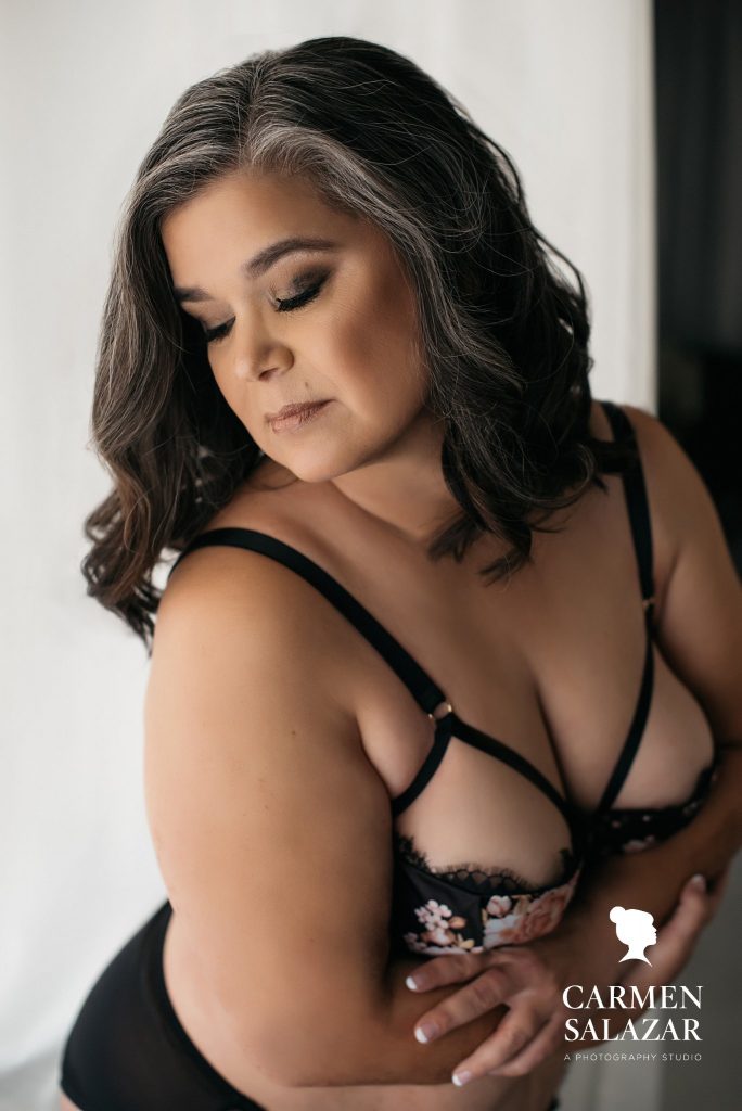 Woman in floral black lingerie; boudoir photography by Carmen Salazar