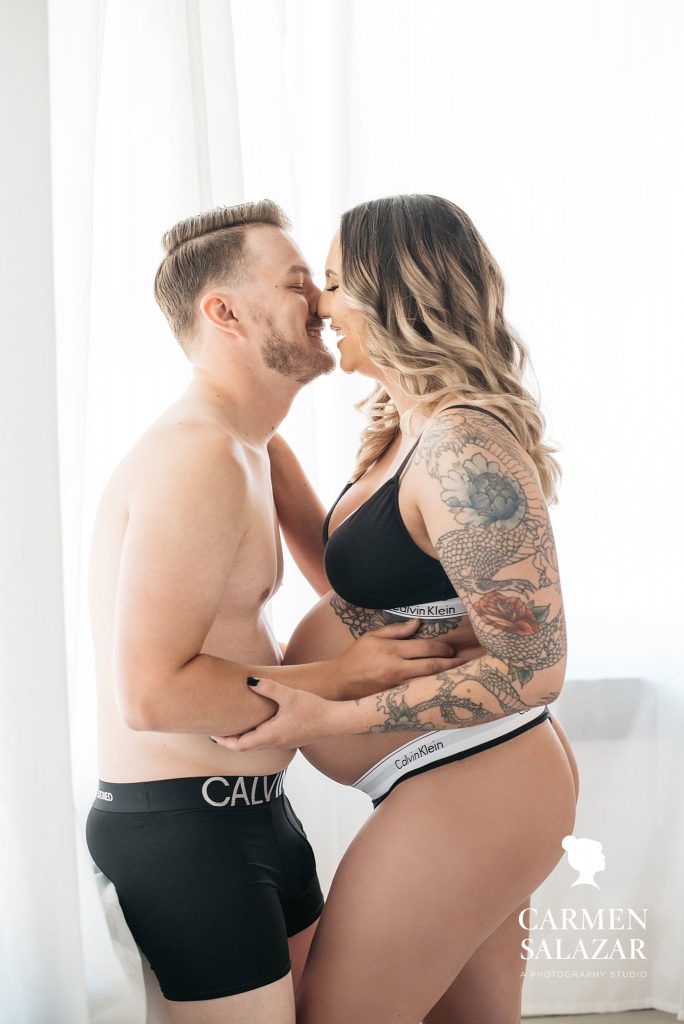 Couple in matching Calvin Klein Intimates, Couple’s Maternity Boudoir Photography by Carmen Salazar