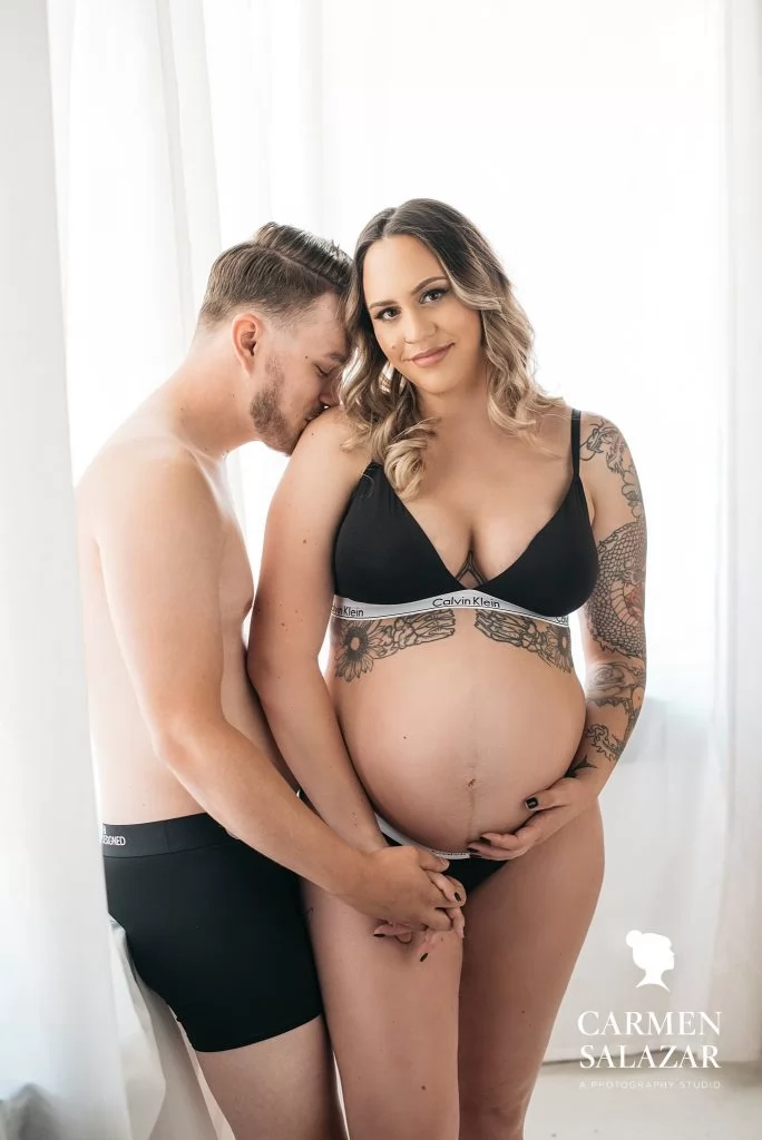 Couple in matching Calvin Klein Intimates, Couple’s Maternity Boudoir Photography by Carmen Salazar