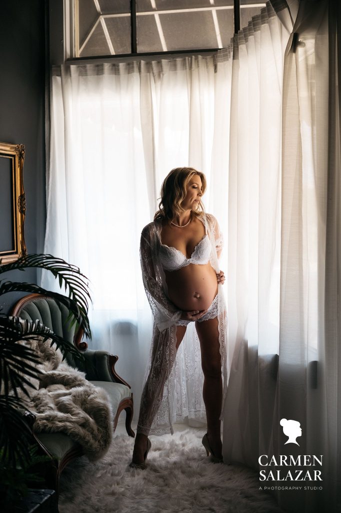 woman in white lingerie, maternity boudoir by Carmen Salazar
