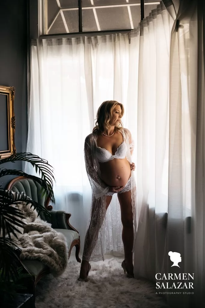 woman in white lingerie, maternity boudoir by Carmen Salazar