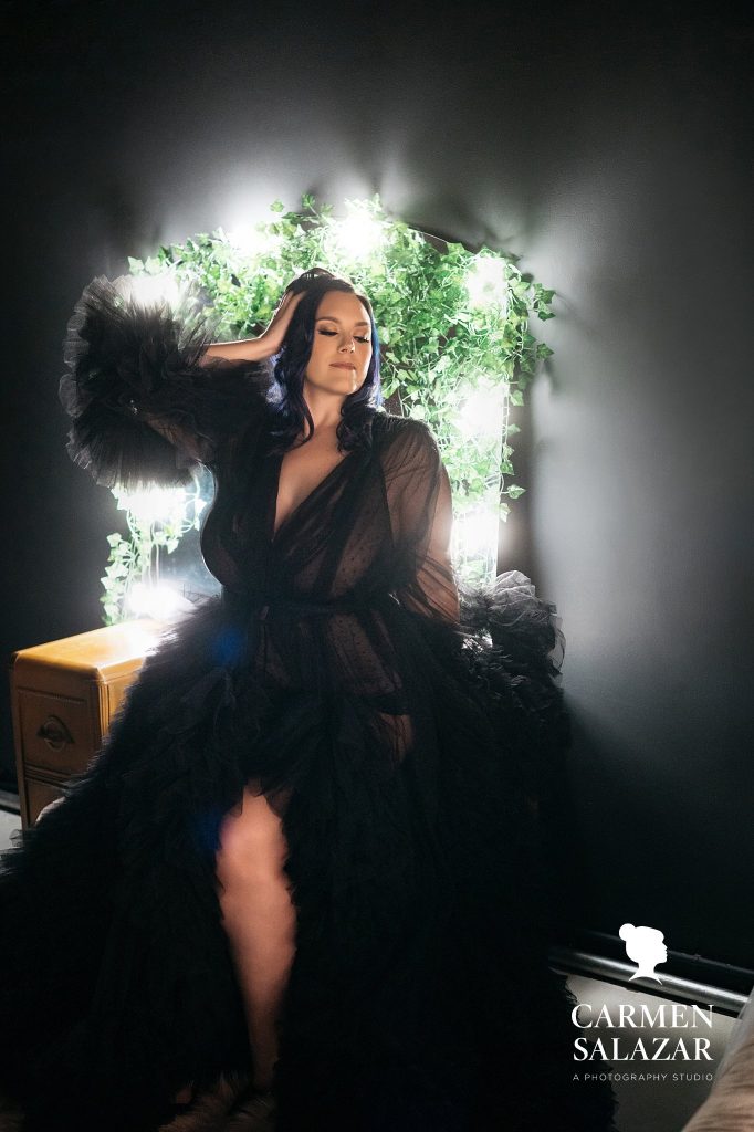 woman in Hollywood glam black robe against vintage vanity; photography by Carmen Salazar