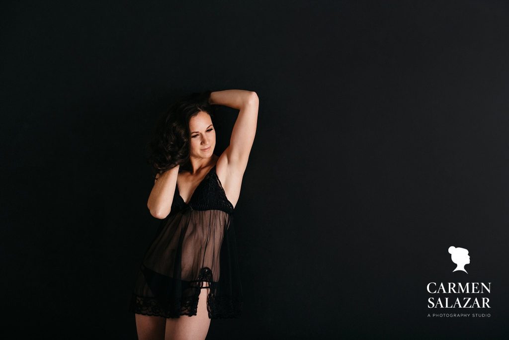 woman in black sheer babydoll lingerie, boudoir photography by Carmen Salazar