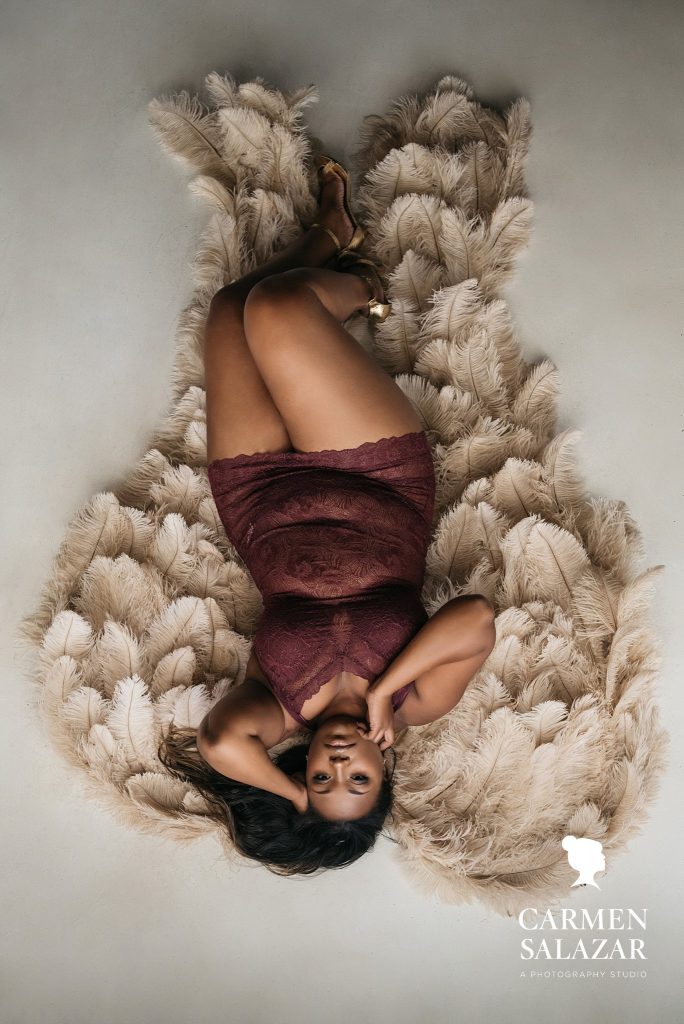 Love the Skin You're In; african american woman in angel wings wide angle, boudoir photography by Carmen Salazar