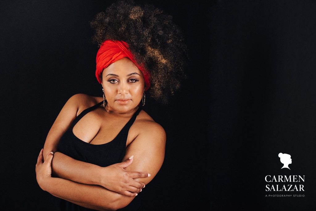 Woman in black tank top and red buff, overcome body image insecurities, boudoir photography by Carmen Salazar