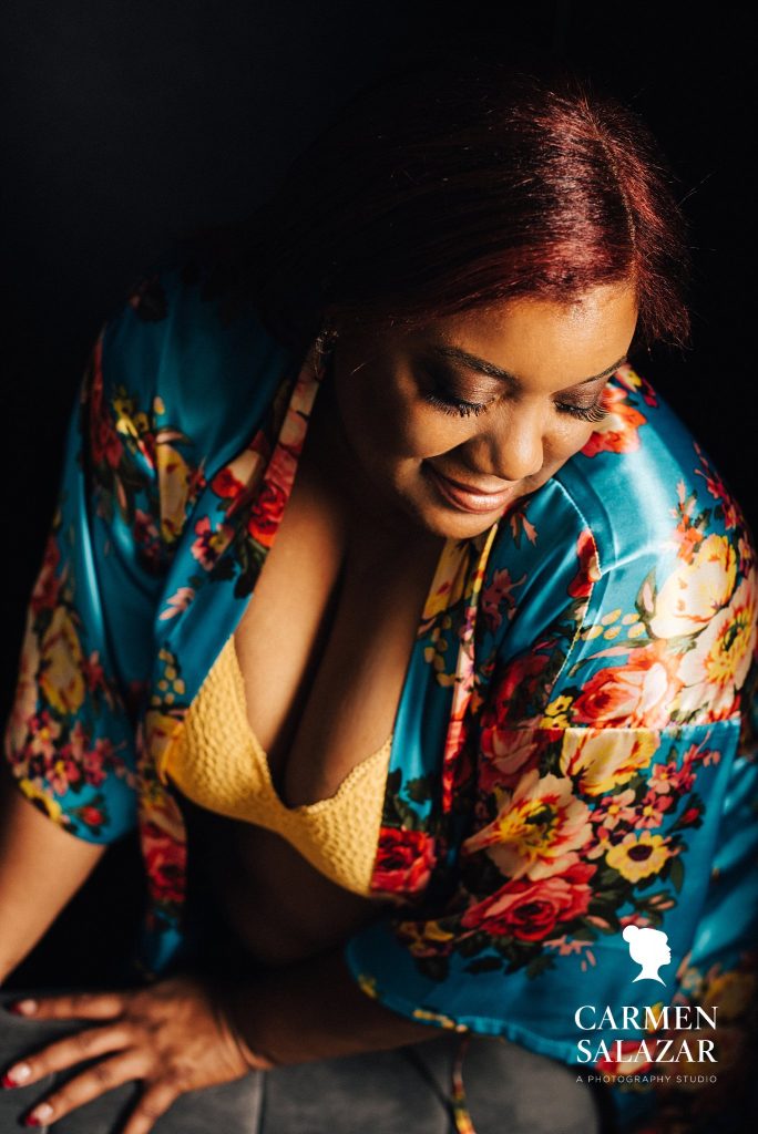 African American Woman in brightly colored robe and yellow bra; Boudoir photography by Carmen Salazar