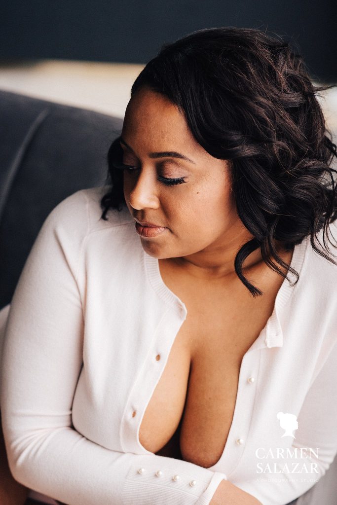 African American Woman in white sweater; boudoir photography by Carmen Salazar