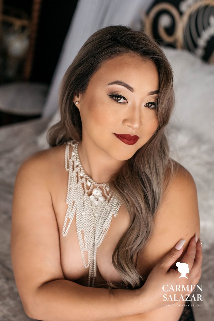 Asian American woman in pearls; prepare your mind for an empowering boudoir photography session; by Carmen Salazar