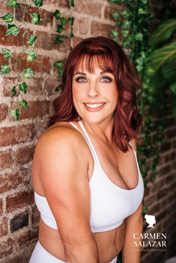 Fitness portrait of red-headed woman; boudoir photography by Carmen Salazar