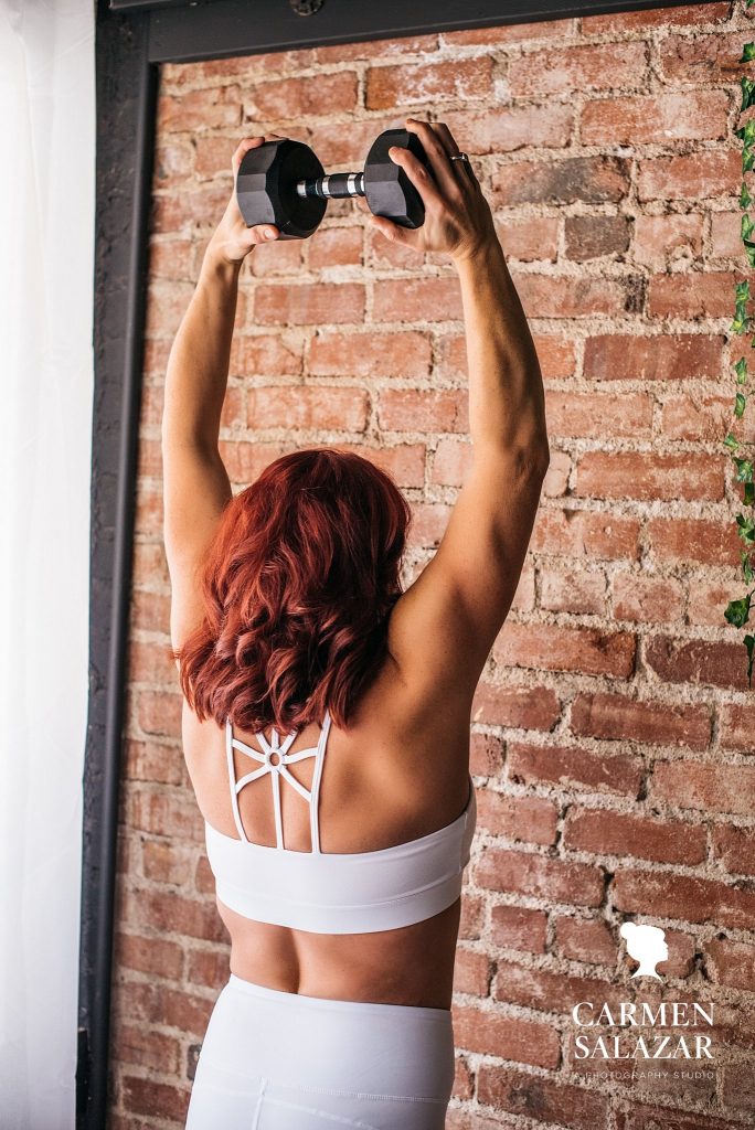 Fitness portrait of red-headed woman; boudoir photography by Carmen Salazar