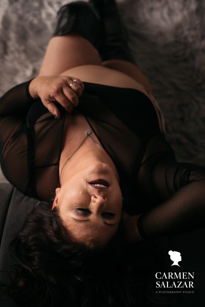 Show Of Your Unique Personality through boudoir photography with Carmen Salazar, woman in black lingerie striking a sexy pose
