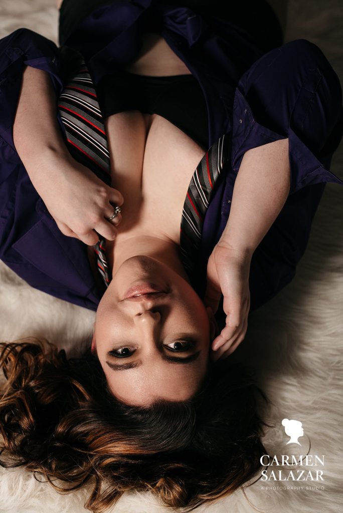 Brunette in men's button down shirt and tie; boudoir photography by Carmen Salazar