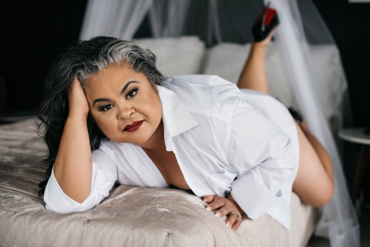 Woman posing Between the Sheets Non-Lingerie Outfits for Boudoir Photography by Carmen Salazar